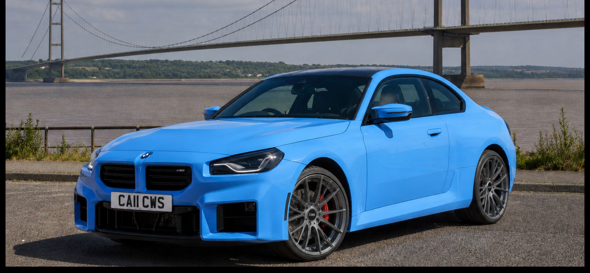 Bright blue BMW M2 with freshly refurbished alloy wheels beside the Humber Bridge, Yorkshire